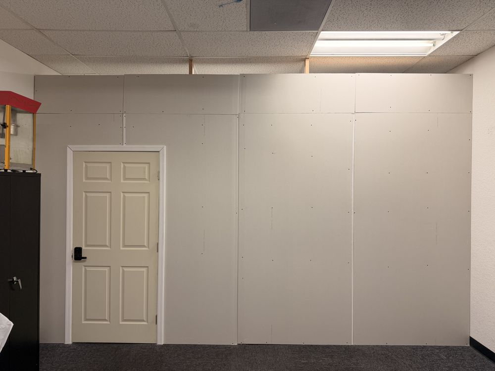 A finished partition wall with a new door